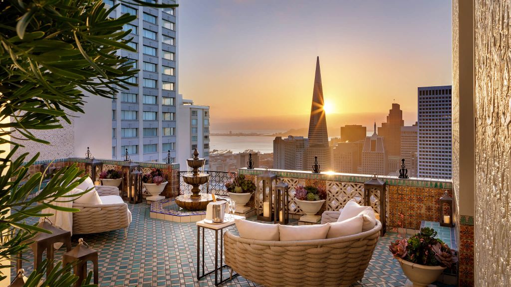 Fairmont San Francisco penthouse terrace at golden hour with Transamerica pyramid view — luxury hospitality install